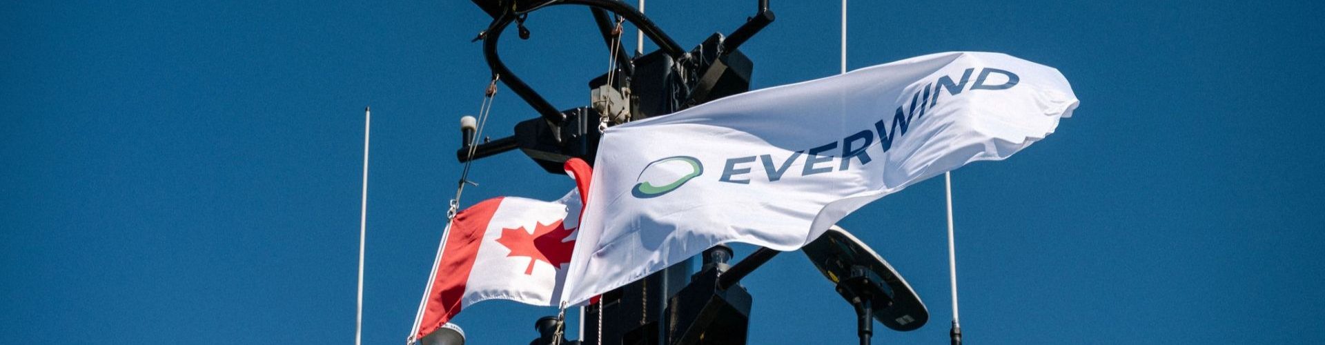 The EverWind flag flaps in the breeze beside the Canada flag